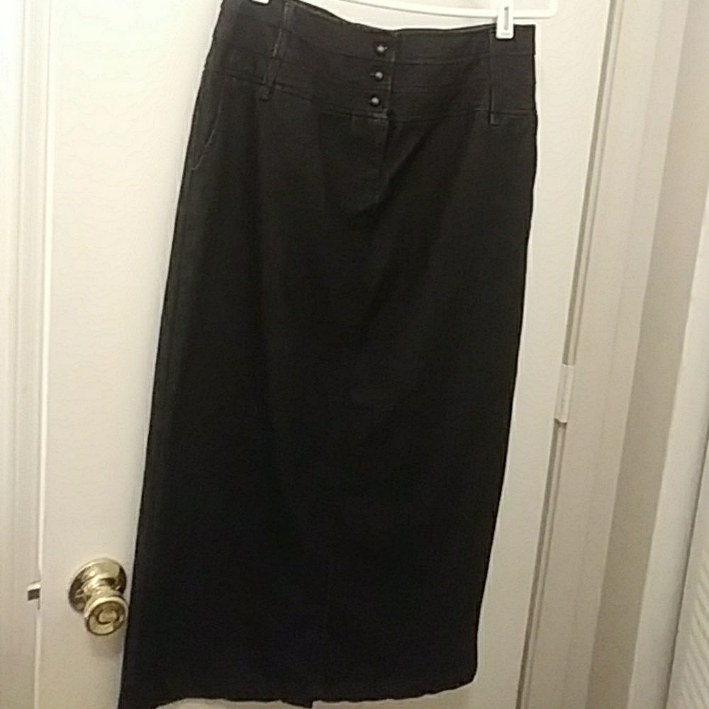 Long black jean skirt .